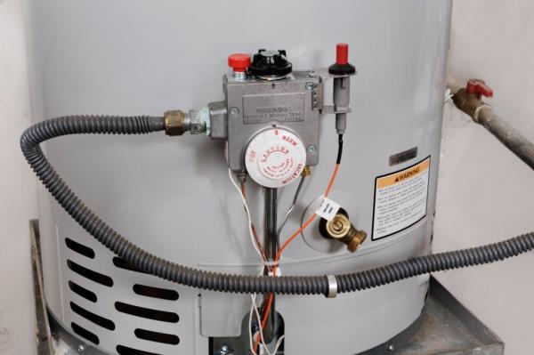 water heater with hose, co<em></em>ntrol knobs, and vents