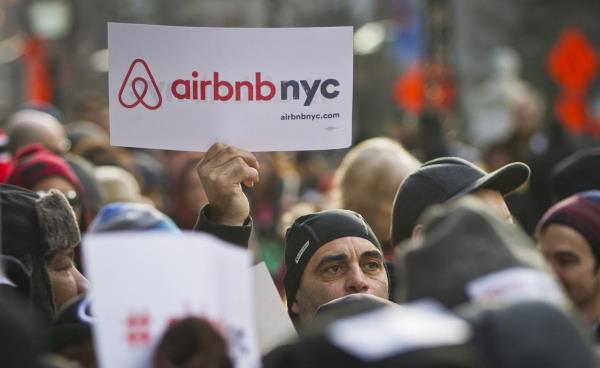 Supporters of Airbnb hold a rally outside City Hall in 2015.