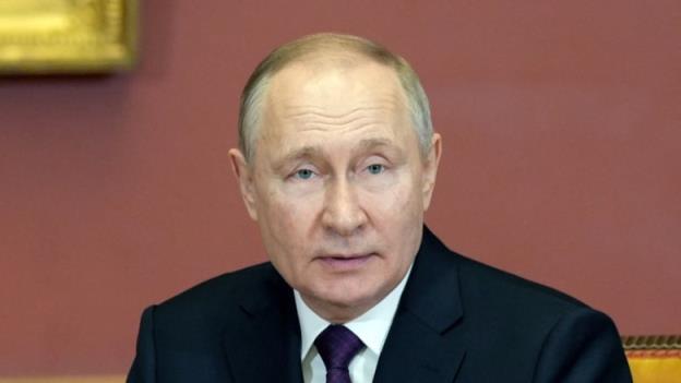 Russian President Vladimir Putin attends a meeting.