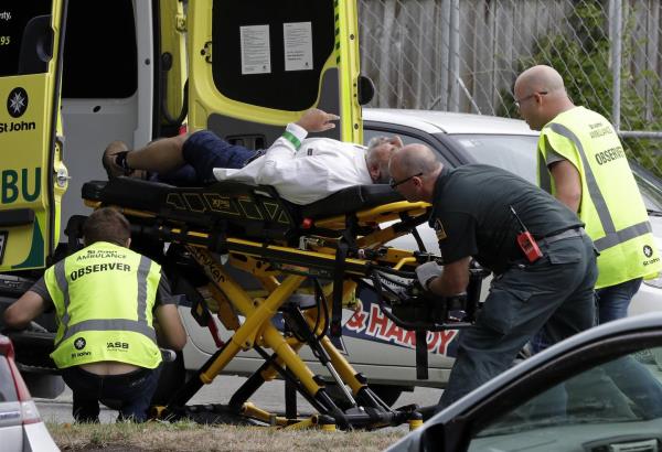 In this March 15, 2019, file photo, ambulance staff take a man from outside a mosque in central Christchurch, New Zealand. 