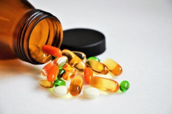 vitamins and supplements with brown bottle